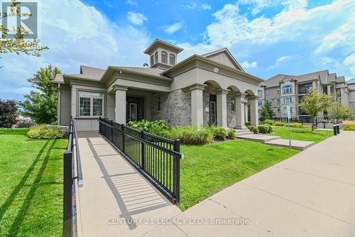 214 - 1460 Main Street E, Milton, ON - Outdoor With Facade