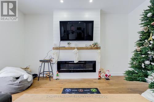 30 Gold Park Gate, Essa, ON - Indoor Photo Showing Living Room With Fireplace