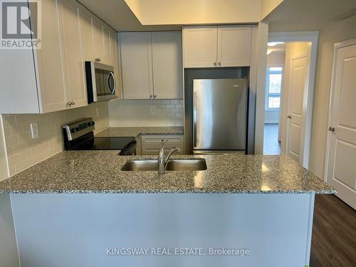 107 - 1577 Rose Way, Milton, ON - Indoor Photo Showing Kitchen With Double Sink With Upgraded Kitchen