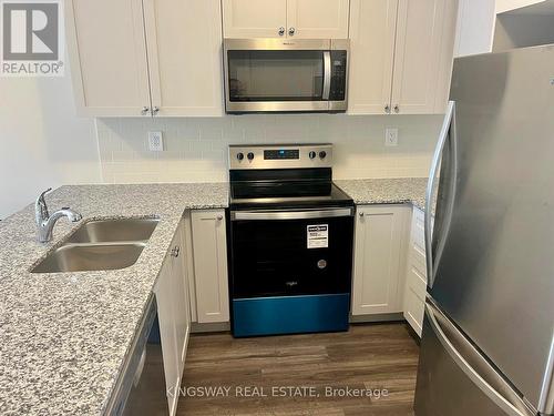 107 - 1577 Rose Way, Milton, ON - Indoor Photo Showing Kitchen With Stainless Steel Kitchen With Double Sink