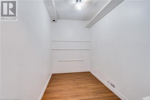 Primary bedroom walk in closet - 700 Dynes Road Unit# 109, Burlington, ON - Indoor Photo Showing Other Room