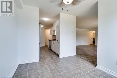 Eating area to kitchen and living/dining room areas - 700 Dynes Road Unit# 109, Burlington, ON - Indoor Photo Showing Other Room