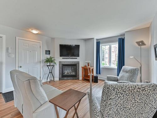 Salon - 2230 Rue Isaac-Jogues, Saint-Jérôme, QC - Indoor Photo Showing Living Room With Fireplace