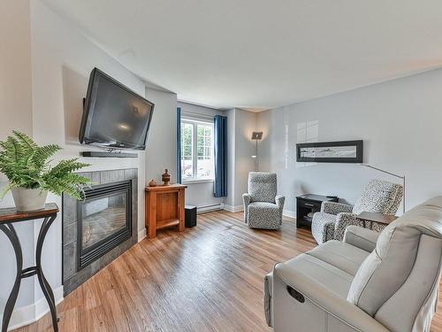 Salon - 2230 Rue Isaac-Jogues, Saint-Jérôme, QC - Indoor Photo Showing Living Room With Fireplace