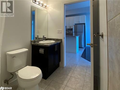 Bathroom with tile patterned flooring, vanity, and toilet - 2486 Old Bronte Road Unit# 813, Oakville, ON 