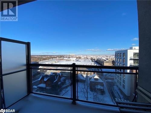 View of snow covered back of property - 2486 Old Bronte Road Unit# 813, Oakville, ON 