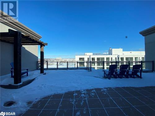 View of snow covered patio - 2486 Old Bronte Road Unit# 813, Oakville, ON 