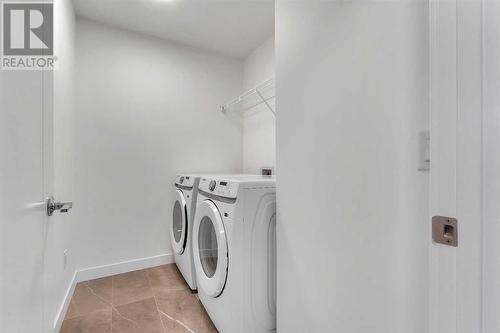 239 Kinniburgh Loop, Chestermere, AB - Indoor Photo Showing Laundry Room