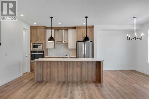 239 Kinniburgh Loop, Chestermere, AB - Indoor Photo Showing Kitchen With Stainless Steel Kitchen With Upgraded Kitchen