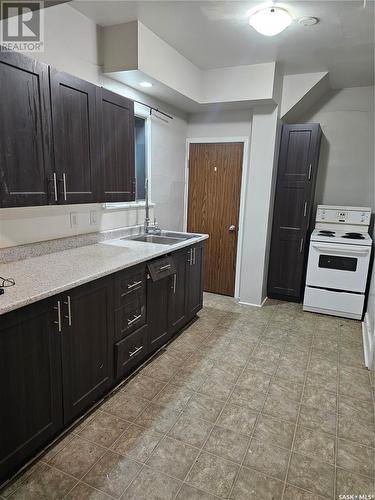 223 I Avenue S, Saskatoon, SK - Indoor Photo Showing Kitchen With Double Sink