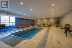 View of swimming pool featuring a jacuzzi - 