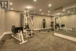 Workout area featuring dark colored carpet - 