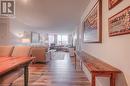 Living room with wood-type flooring and a textured ceiling - 55 Green Valley Drive Drive Unit# 1806, Kitchener, ON  - Indoor 