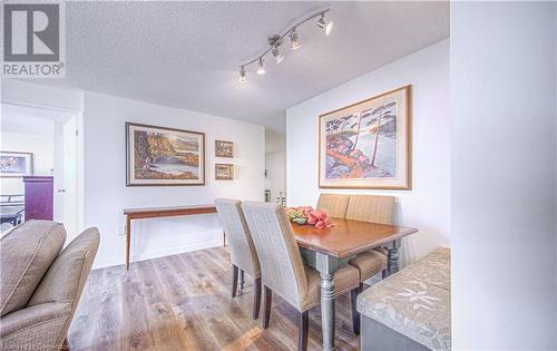 Dining room featuring light hardwood / wood-style floors and a textured ceiling - 55 Green Valley Drive Drive Unit# 1806, Kitchener, ON - Indoor Photo Showing Dining Room