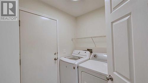 246 Saddlefield Place Ne, Calgary, AB - Indoor Photo Showing Laundry Room