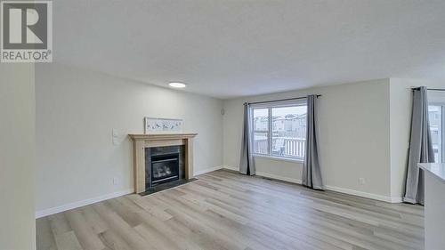 246 Saddlefield Place Ne, Calgary, AB - Indoor Photo Showing Living Room With Fireplace