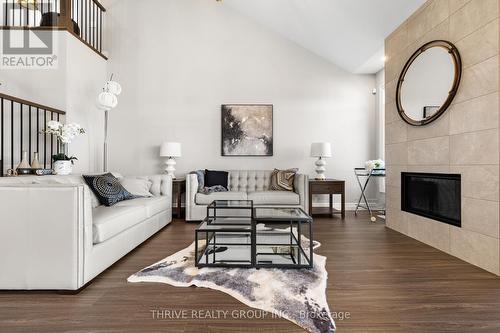 1 - 1061 Eagletrace Drive, London, ON - Indoor Photo Showing Living Room With Fireplace