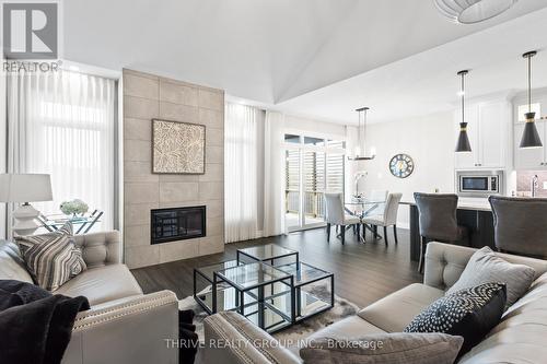 1 - 1061 Eagletrace Drive, London, ON - Indoor Photo Showing Living Room With Fireplace