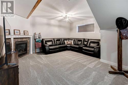 45 Mackenzie Way, Carstairs, AB - Indoor With Fireplace