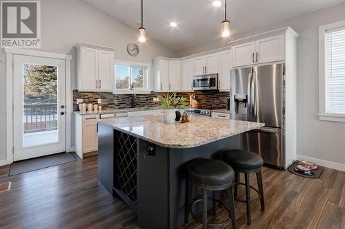 45 Mackenzie Way, Carstairs, AB - Indoor Photo Showing Kitchen With Upgraded Kitchen