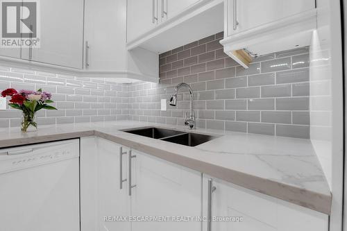 134 - 1496 Pilgrims Way, Oakville, ON - Indoor Photo Showing Kitchen With Double Sink