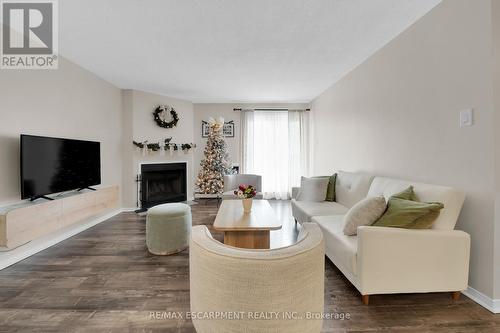 134 - 1496 Pilgrims Way, Oakville, ON - Indoor Photo Showing Living Room With Fireplace