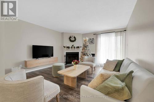 134 - 1496 Pilgrims Way, Oakville, ON - Indoor Photo Showing Living Room With Fireplace