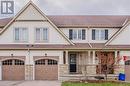 Craftsman-style home with a front yard and a garage - 74 Shallow Creek Road, Woolwich, ON  - Outdoor With Facade 