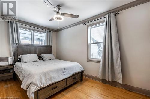 Primary Bedroom With Hardwood Flooring And Crown Molding - 111 Spruce Street, Cambridge, ON - Indoor Photo Showing Bedroom