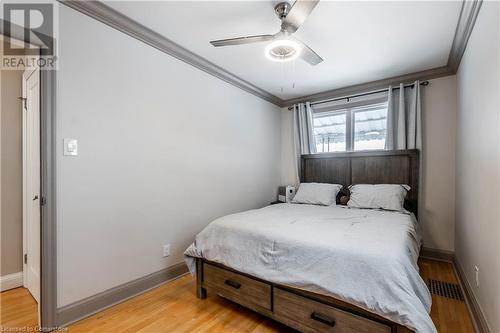 Primary Bedroom With Hardwood Flooring And Crown Molding - 111 Spruce Street, Cambridge, ON - Indoor Photo Showing Bedroom