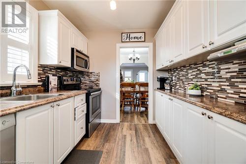 Kitchen with sink, white cabinetry, stainless steel appliances, and a wealth of natural light - 245 St Andrews Street, Cambridge, ON - Indoor Photo Showing Kitchen With Upgraded Kitchen