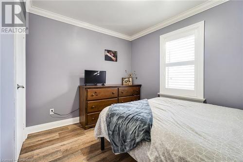 Bedroom with hardwood / wood-style floors and ornamental molding - 245 St Andrews Street, Cambridge, ON - Indoor Photo Showing Bedroom