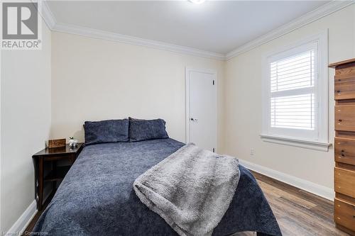 Bedroom featuring wood-type flooring and crown molding - 245 St Andrews Street, Cambridge, ON - Indoor Photo Showing Bedroom