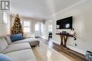 Living room featuring dark hardwood / wood-style floors and ornamental molding - 245 St Andrews Street, Cambridge, ON  - Indoor Photo Showing Living Room 