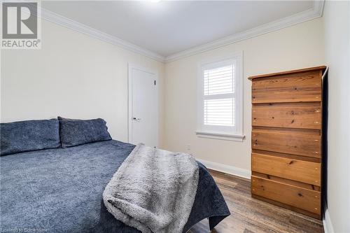 Bedroom with crown molding and wood-type flooring - 245 St Andrews Street, Cambridge, ON - Indoor Photo Showing Bedroom