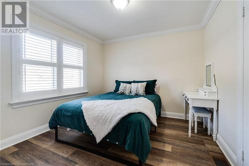 Bedroom with dark hardwood / wood-style floors and ornamental molding - 245 St Andrews Street, Cambridge, ON - Indoor Photo Showing Bedroom