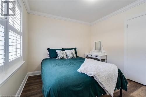 Bedroom featuring dark hardwood / wood-style flooring and ornamental molding - 245 St Andrews Street, Cambridge, ON - Indoor Photo Showing Bedroom