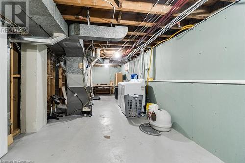 Basement featuring heating unit and washing machine and clothes dryer - 245 St Andrews Street, Cambridge, ON - Indoor Photo Showing Basement