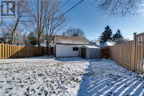 Snow covered back of property with a storage shed - 245 St Andrews Street, Cambridge, ON - Outdoor