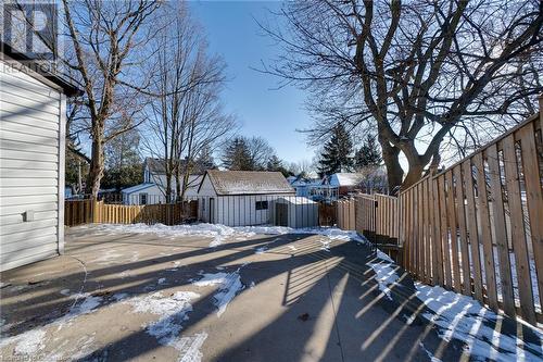 Yard layered in snow with a shed - 245 St Andrews Street, Cambridge, ON - Outdoor