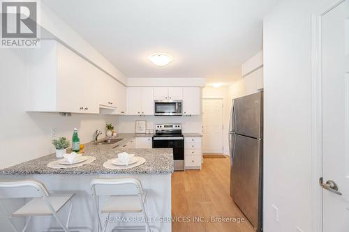 1 - 26 Humberwood Boulevard, Toronto, ON - Indoor Photo Showing Kitchen With Stainless Steel Kitchen With Upgraded Kitchen