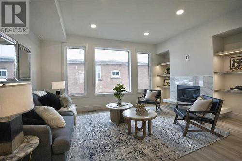 2222 5 Street Sw, Calgary, AB - Indoor Photo Showing Living Room With Fireplace