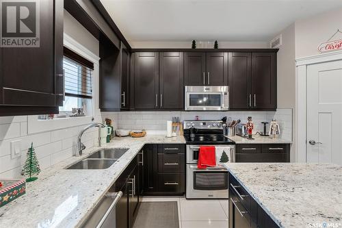 526 Baltzan Bay, Saskatoon, SK - Indoor Photo Showing Kitchen With Double Sink