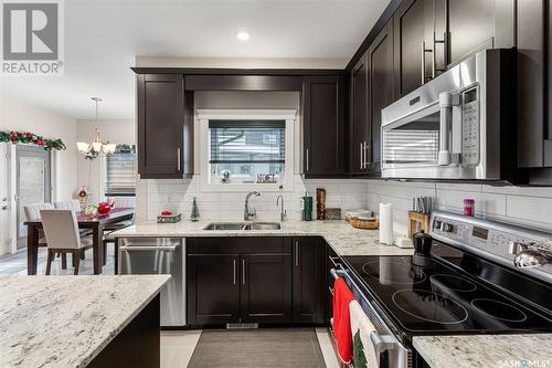 526 Baltzan Bay, Saskatoon, SK - Indoor Photo Showing Kitchen With Double Sink With Upgraded Kitchen