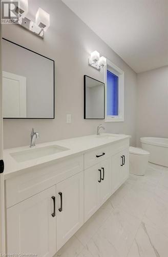 Bathroom featuring vanity and toilet - 705 Hollinger Drive S, Listowel, ON - Indoor Photo Showing Bathroom