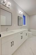 Bathroom featuring vanity and toilet - 