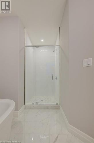 Bathroom with independent shower and bath - 705 Hollinger Drive S, Listowel, ON - Indoor Photo Showing Bathroom