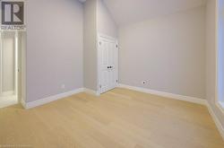 Empty room featuring light hardwood / wood-style flooring - 