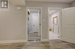 Corridor featuring light hardwood / wood-style flooring - 