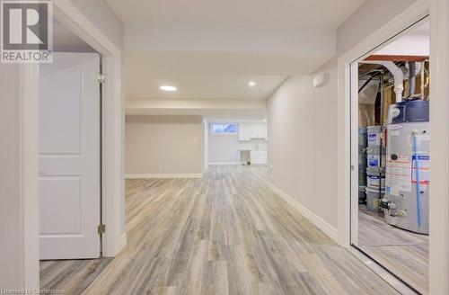 Corridor featuring light hardwood / wood-style flooring and water heater - 705 Hollinger Drive S, Listowel, ON - Indoor